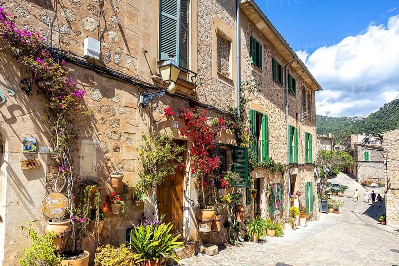 Valldemossa village on Majorca building with flowers trip in Valldemossa, Spain