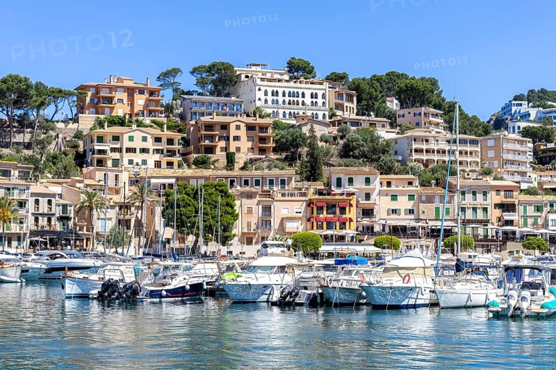 Port de Soller town on Majorca holiday by the sea yacht harbour with boats trip in Port de Sóller, Spain