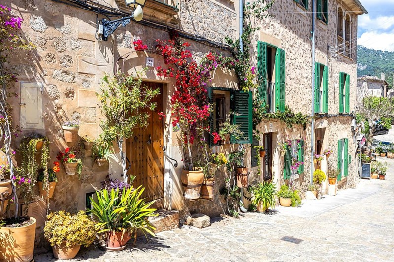 Valldemossa village on Majorca building with flowers trip in Valldemossa, Spain