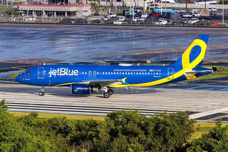 A JetBlue Airways Airbus A320 aircraft with the registration N775JB and the JetBlue Honours our Veterans special livery at San Juan Airport, Puerto Rico