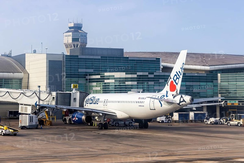 A JetBlue Airways Airbus A320 aircraft with the registration number N586JB and the I love NY special livery at San Juan Airport, Puerto Rico