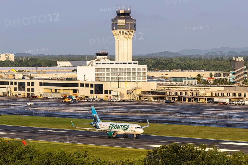 A Frontier Airlines Airbus A320 aircraft with the registration number N238FR at San Juan Airport, Puerto Rico