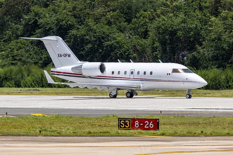 A Bombardier Challenger 604 private jet aircraft with the registration XA-OFM at San Juan Airport, Puerto Rico