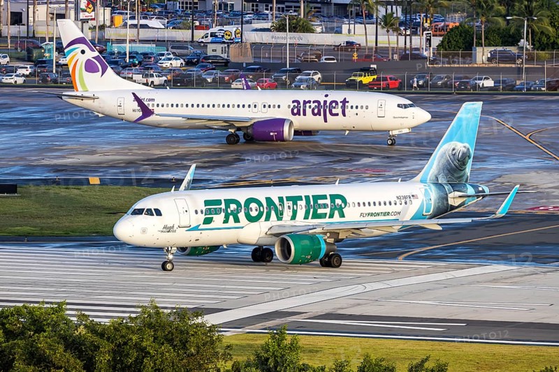 A Frontier Airlines Airbus A320 aircraft with the registration number N238FR at San Juan Airport, Puerto Rico