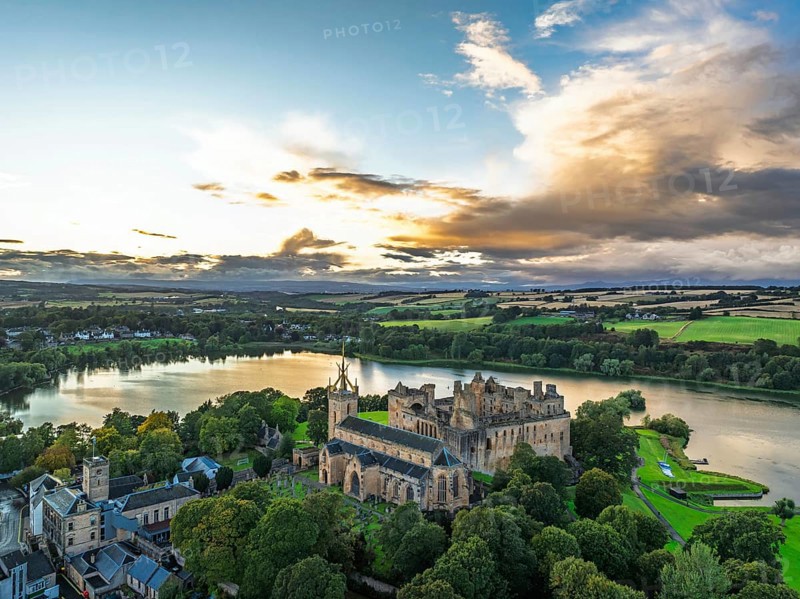 Sunset over Linlithgow Palace from a drone, Linlithgow Loch, West Lothian, Scotland, United Kingdom