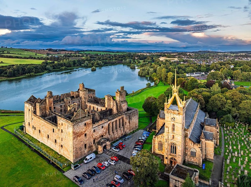 Sunset over Linlithgow Palace from a drone, Linlithgow Loch, West Lothian, Scotland, United Kingdom