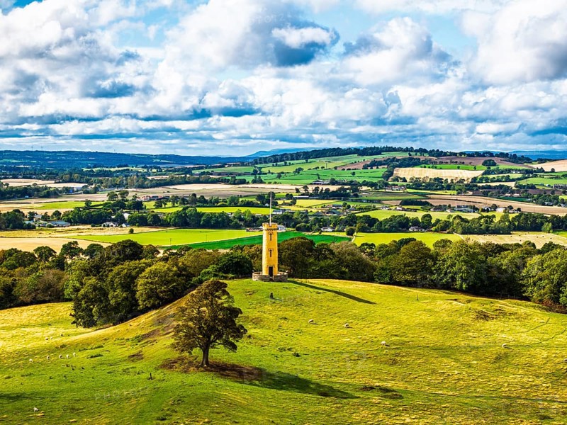 Binns Tower over Scotish farms and Forth Estuary from drone, House of the Binns, Linlithgow, Scotland, UK