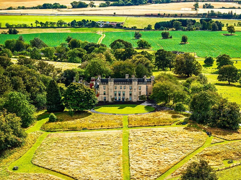 DefaultHouse of the Binns over Scotish farms and Forth Estuary from drone, Binns Tower, Linlithgow, Scotland, UK