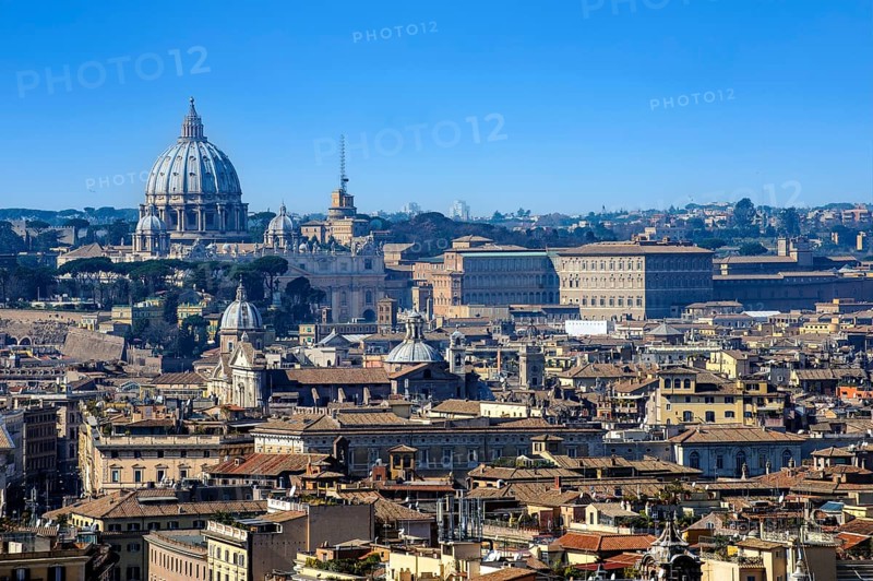 View over the historic centre of Rome with Vatican City in the background and St. Peter's Basilica on the left. Antenna of Vatican Radio to the right, Palazzo Apostolico Apostolic Palace to the right, Rome, Lazio, Italy