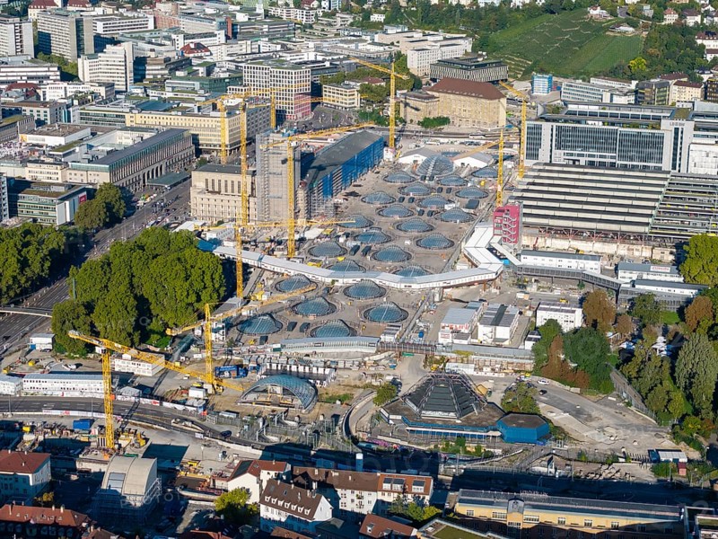 Spacious construction site with modern glass buildings and cranes in a sunny urban landscape, large construction site, Stuttgart railway station, Stuttgart 21, Baden-Württemberg, Germany