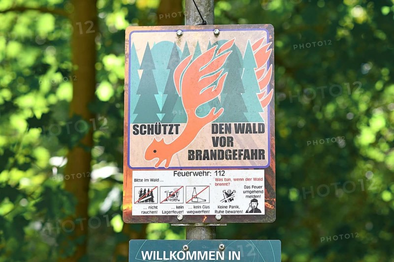Mannheim, Germany - July 31st 2025: German forest fire hazard warning sign in dry woodland forest