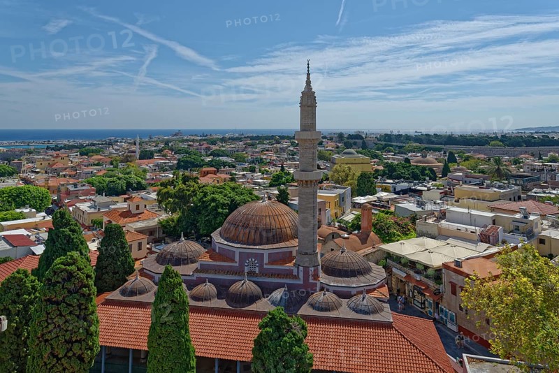 A panoramic view with minaret and domes in front of a cityscape of Rhodes and the sea in the background, Suleiman Mosque, Medieval Town of Rhodes, Rhodes Island, Greece