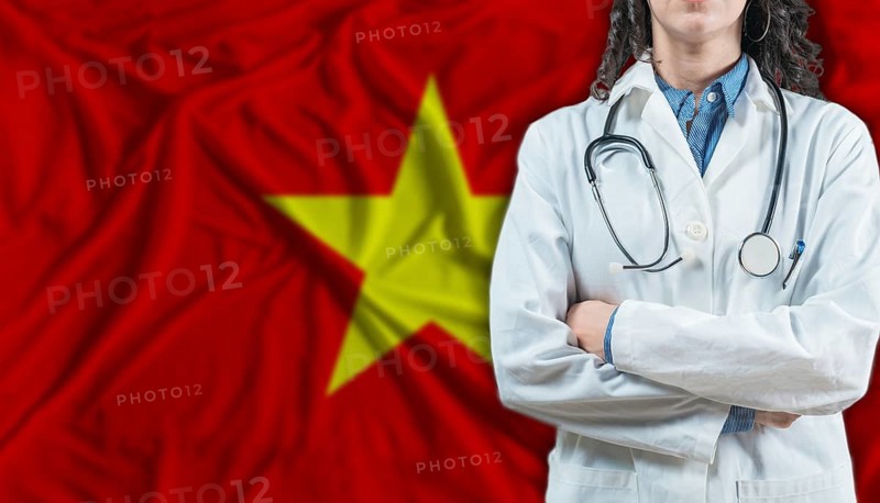Medical professional on Vietnam flag. Healthcare and wellness in Vietnam, Concept