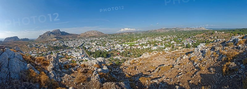 Panoramic view of the town of Archangelos in the middle of a vast and sunny mountain landscape, Archangelos, Rhodes Island, Greece