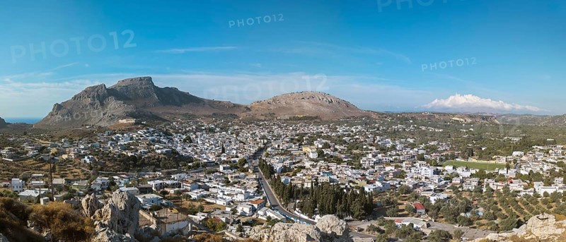 Panorama of the town of Archangelos in a sunny landscape, surrounded by mountains under a clear sky, Archangelos, Rhodes Island, Greece