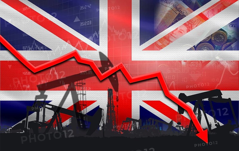 Petroleum crisis with United Kingdom flag on financial graph. Fall oil price with flag of United Kingdom on economic chart