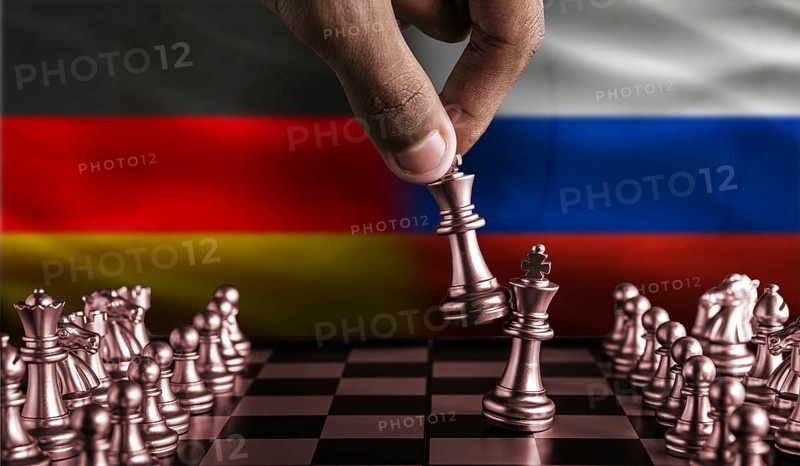 Political tension between Germany and Russia. Germany vs Russia flag on chessboard
