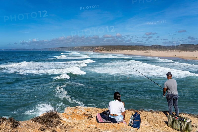 Anglers on the cliffs at the viewpoint above Praia da Bordeira beach, near Carrapateira, popular with surfers, surfers, rocky coast, cliffs in the south-west of the Algarve, Portugal