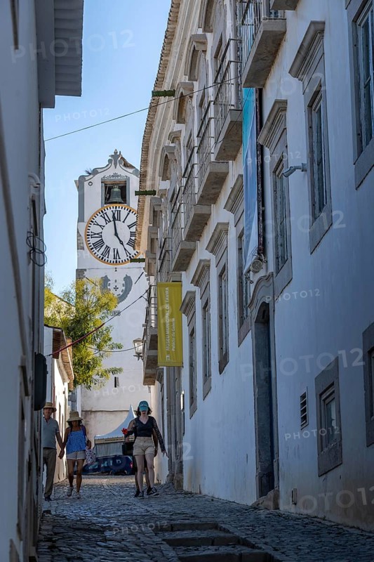 Old town alleys, catholic church Igreja de Santa Maria do Castelo in Tavira, in the Algarve, Portugal