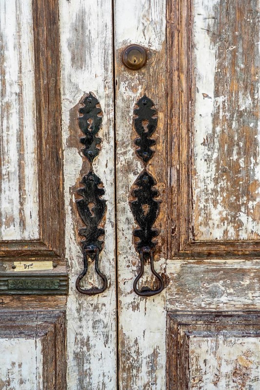 The old town centre of Tavira, typical door knockers found on many wooden doors in the town, Algarve, Portugal