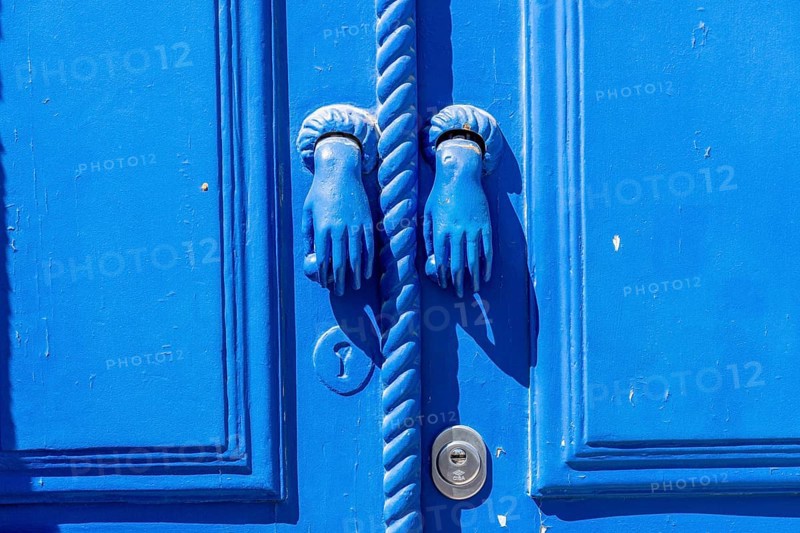 The old town centre of Tavira, typical door knockers found on many wooden doors in the town, Algarve, Portugal