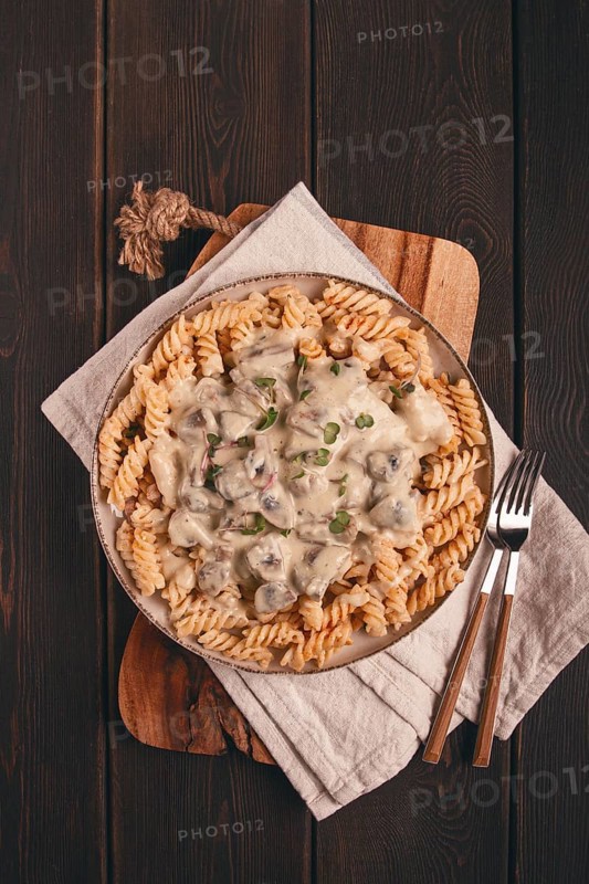 Fusilli pasta, with champignons in creamy garlic sauce, with herbs and spices, sauce, no people