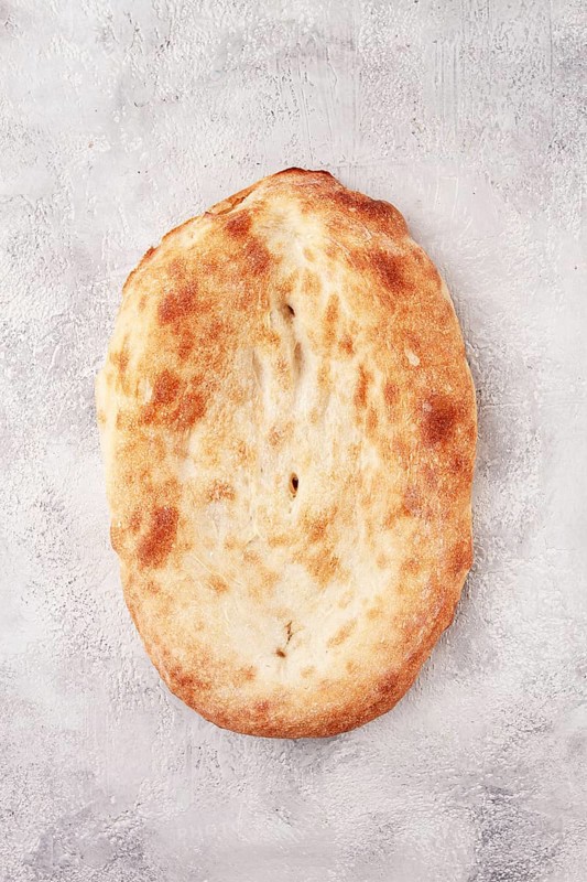 Georgian lavash bread, freshly baked, top view, on the table, no people