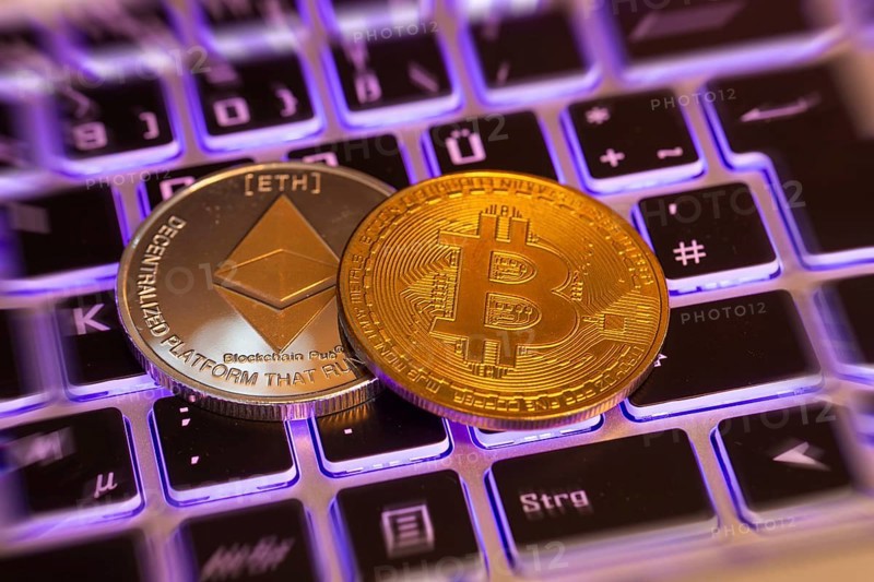 Cryptocurrencies: Close-up of a symbolic Bitcoin and Ethereum