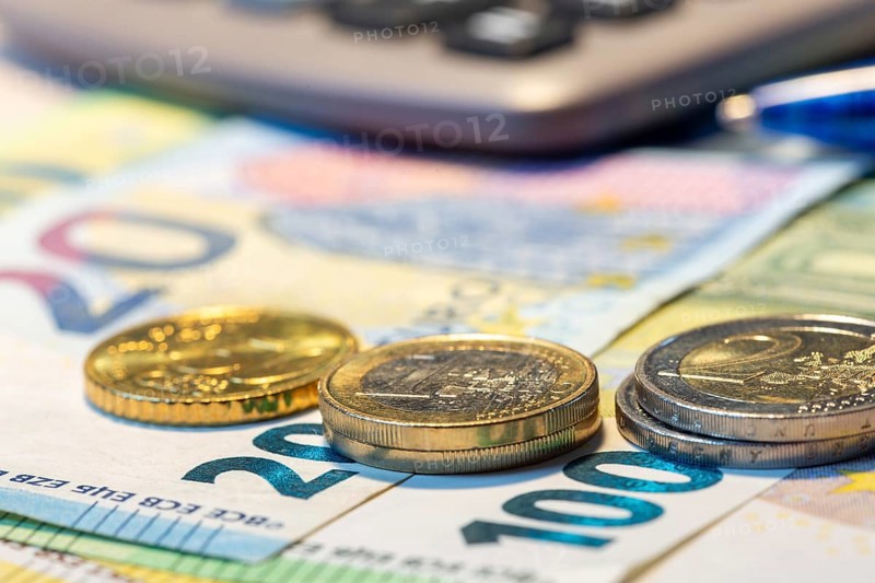 Close-up of euro banknotes and euro coins