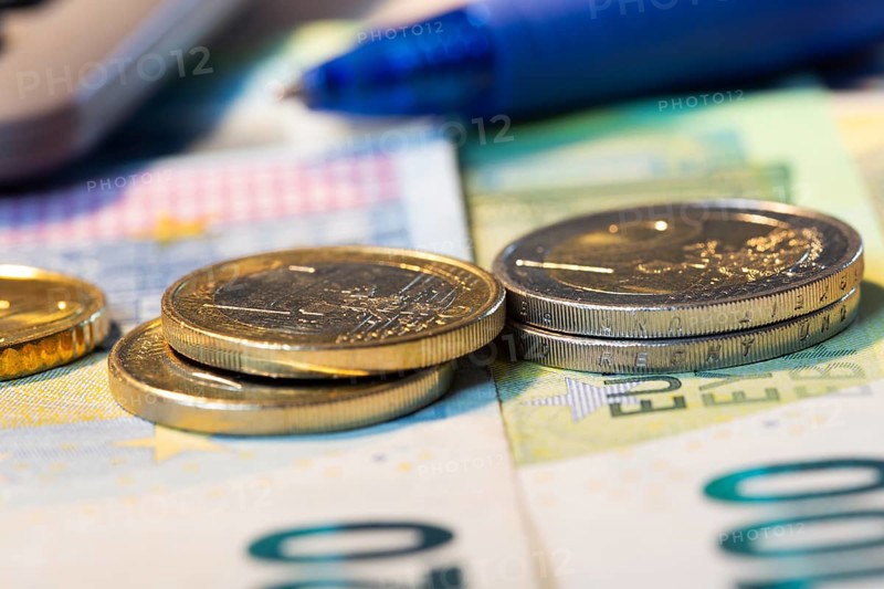 Close-up of euro banknotes and euro coins