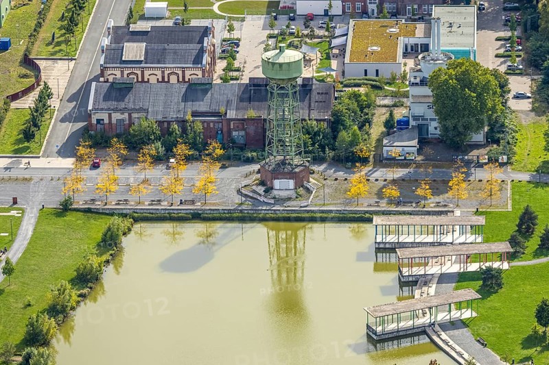 Aerial view, Bergpark Lohberg Kreativquartier, former colliery site and landscaping, Lohberger Weiher with water tower and shadows, Oberlohberg, Dinslaken, Ruhr area, North Rhine-Westphalia, Germany, DE, Europe, Hanseatic city, creative quarter, aerial view, aerial photography, aerial photography, Lower Rhine, tower, overview, bird's eye view, colliery, birds-eyes view, former colliery, overview