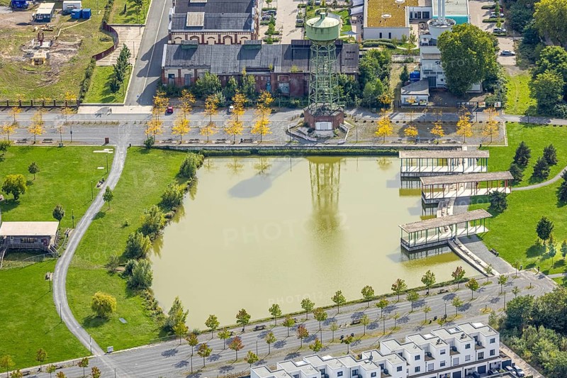 Aerial view, Bergpark Lohberg Kreativquartier, former colliery site and landscaping, Lohberger Weiher with water tower and shadows, Oberlohberg, Dinslaken, Ruhr area, North Rhine-Westphalia, Germany, DE, Europe, Hanseatic city, creative quarter, aerial view, aerial photography, aerial photography, Lower Rhine, tower, overview, bird's eye view, colliery, birds-eyes view, former colliery, overview