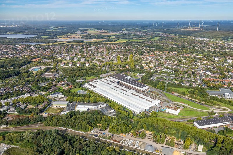 Aerial view, Benteler Steel/Tube GmbH factory premises, view of Bruch and Lohberg district, behind wind turbine plant, Dinslaken, Ruhr area, North Rhine-Westphalia, Germany, alternative energy, DE, Europe, property tax, Hanseatic city, real estate, aerial view, aerial photography, aerial photography, Lower Rhine, overview, bird's-eye view, WTG, wind energy, wind farm, wind power, wind turbine, wind park, wind turbine, wind wheels, residential area, housing and living, residential area, residential quality, residential neighbourhood, housing estate, residential district, birds-eyes view, overview