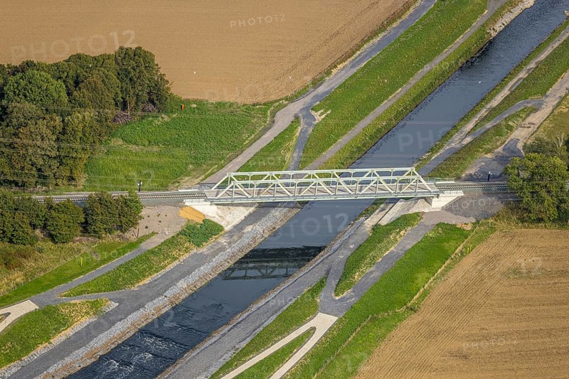 Aerial view, new railway bridge over the river Emschher, river bed, Eppinghoven, Dinslaken, Ruhr area, North Rhine-Westphalia, Germany, construction work, construction area, building site, building plots, construction project, construction site, bridge, DE, Europe, river, river bed, Hanseatic city, aerial view, aerial photography, aerial photography, new construction, Lower Rhine, river bed, overview, bird's eye view, birds-eyes view, overview