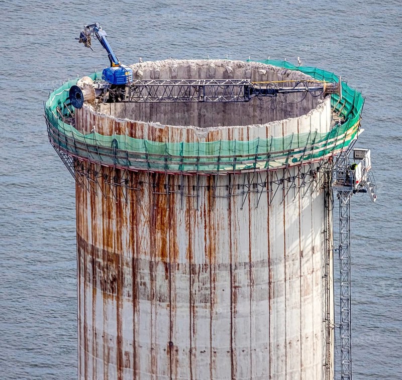Aerial view, construction site with dismantling work on a tower of the Voerde power plant, Möllen, Voerde, Ruhr area, North Rhine-Westphalia, Germany, demolition work, excavator, construction work, construction site, building site, construction project, construction site, DE, Europe, aerial view, aerial photography, aerial photography, Lower Rhine, dismantling, overview, Voerde (Lower Rhine), bird's eye view, bird's eye view, overview