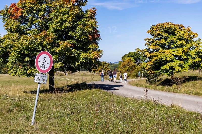 Hikers in the Swabian Alb biosphere reserve. The former military training area in Münsingen is an important part of this area. Signpost Danger to life from unexploded ordnance. The protected area is an 85, 270-hectare biosphere reserve of the state of Baden-Württemberg. The area has been a UNESCO biosphere reserve since May 2009. Münsingen, Baden-Württemberg, Germany