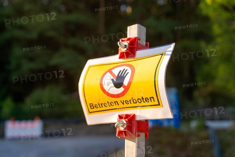 A warning sign with the inscription 'No trespassing' stands on a forest road, Hermann Hessebahn construction site, Calw, Germany