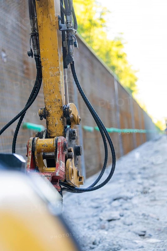 Close-up of a construction machine with hoses on a construction wall, Hermann Hessebahn construction site, Calw, Germany