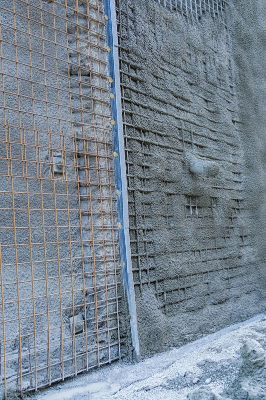 Close-up of a concrete wall with visible wire mesh on a construction site, Hermann Hessebahn construction site, Calw, Germany