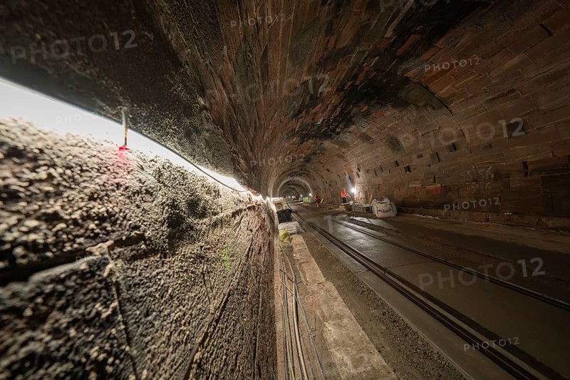 Tunnel with tracks and construction work, illuminated by line lights, construction of the Hermann Hesse railway, Calw, Black Forest, Germany