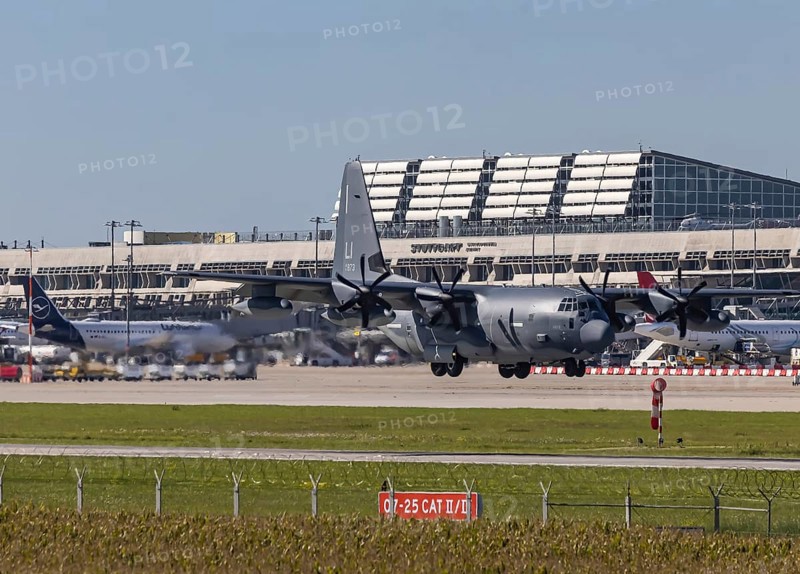 Stuttgart Airport with terminal and US Air Force Lockheed L-100 Hercules aircraft landing. Stuttgart, Baden-Württemberg, Germany