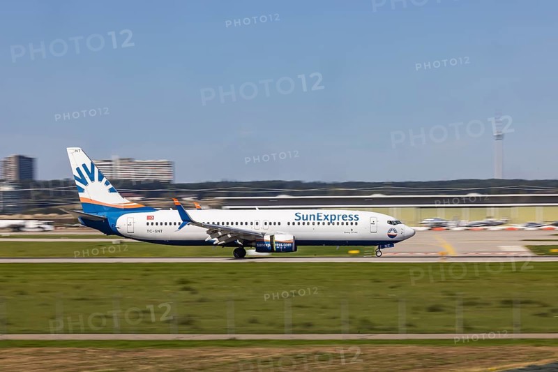 Stuttgart Airport with aircraft on the runway. Aircraft registration number: TC-SNT, SunExpress, Boeing 737-800, Stuttgart, Baden-Württemberg, Germany