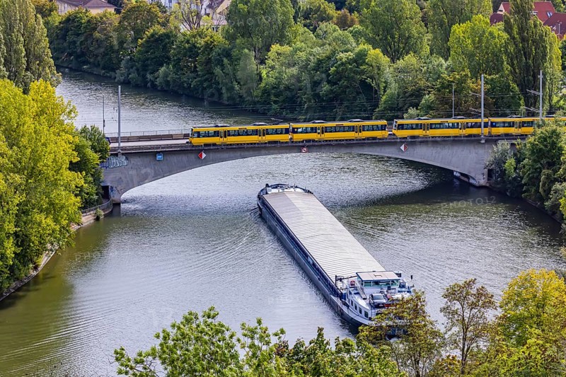 Neckar bridge in Stuttgart with SSB tram. The 105 metre long cargo ship ANNABELL on its way to the port of Stuttgart, Baden-Württemberg, Germany
