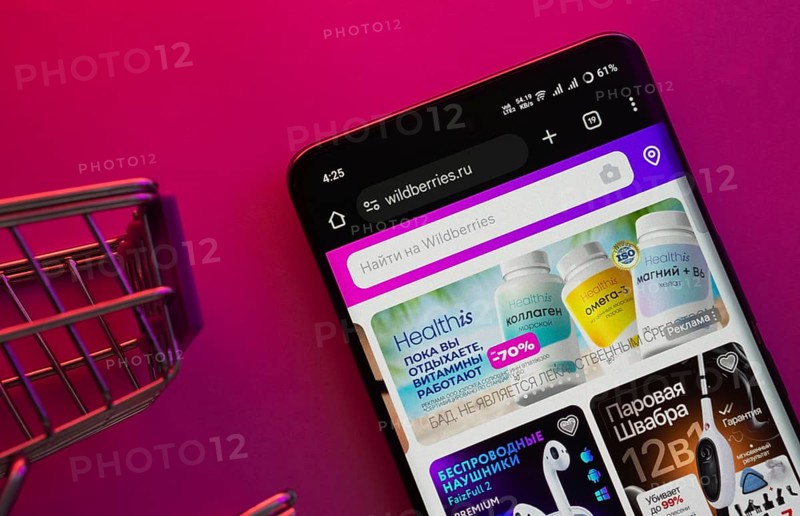 Dhaka, Bangladesh- 23 June 2025: A smartphone displaying the Wildberries website with a shopping cart is shown on a vibrant background