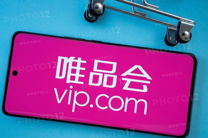 Dhaka, Bangladesh- 03 July 2025: Smartphone screen showing the vip.com logo with shopping cart wheels on a blue background