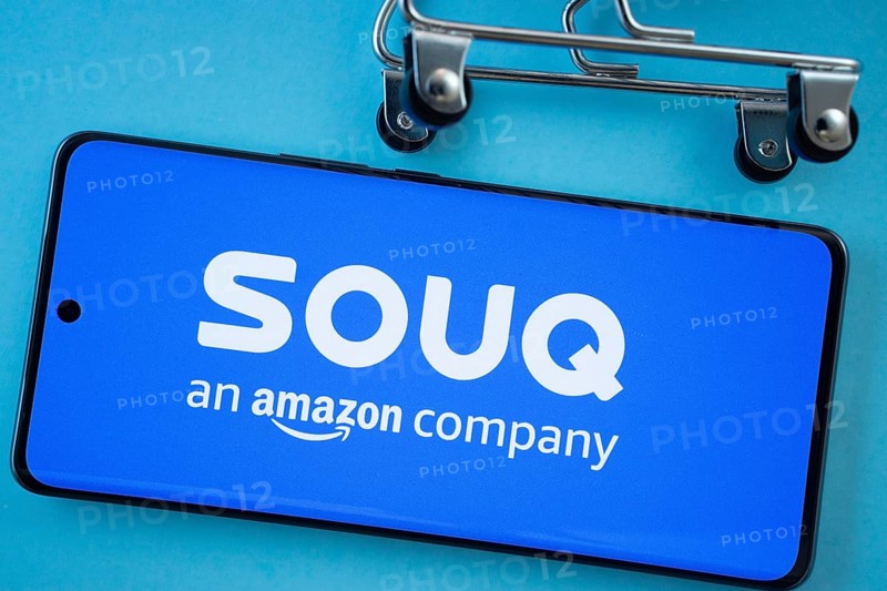 Dhaka, Bangladesh- 03 July 2025: Smartphone screen showing the Souq logo with shopping cart wheels on a blue background