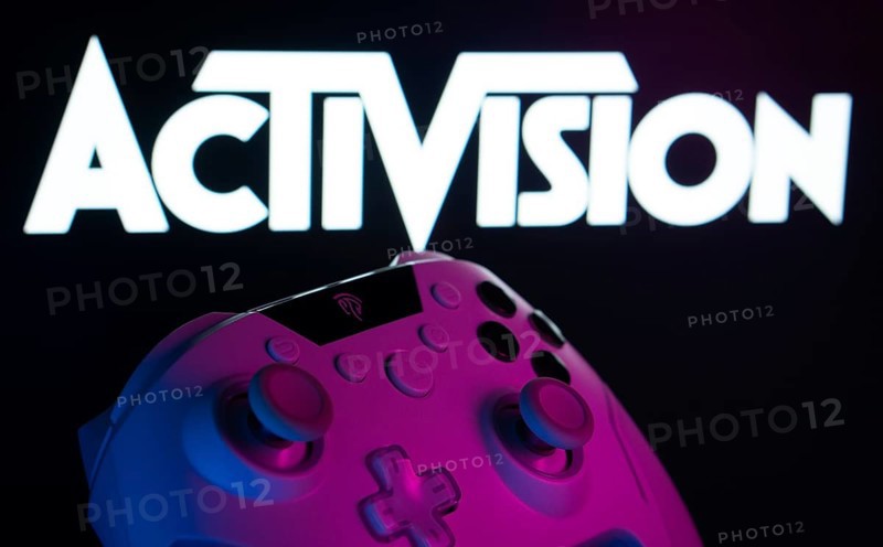 Dhaka, Bangladesh- 23 Sep 2025: A close-up of a white gamepad with the Activision seen on screen in the background