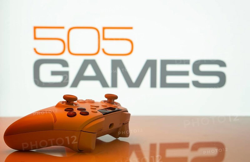 Dhaka, Bangladesh- 23 Sep 2025: Game controller in front of 505 Games logo on a background