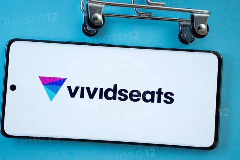 Dhaka, Bangladesh- 03 July 2025: Smartphone screen showing the VividSeats logo with shopping cart wheels on a blue background
