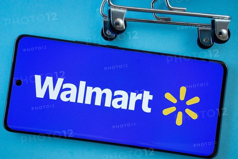 Dhaka, Bangladesh- 03 July 2025: Smartphone screen showing the Walmart logo with shopping cart wheels on a blue background